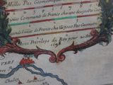 a picture of an old book with a picture of a coat of arms
