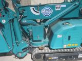 a blue machine that is parked in a garage