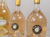 three bottles of wine sitting next to each other on a table