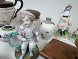 a lot of figurines that are sitting on a table