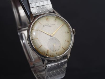 GIRARD PERREGAUX Montre de poignet chromée. Boitier rond. Fo…