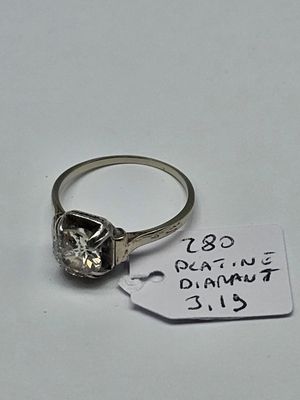 a diamond ring with a price tag attached to it