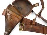an old leather holster with a leather belt and a leather belt