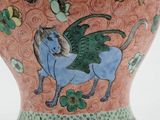 a vase with a horse painted on it