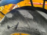 a close up of a tractor tire on a construction site