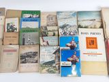 several books are stacked on top of each other on a table