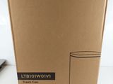 a box that has a glass in it on a table
