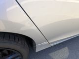 a close up of a car ' s side door with a sticker on it
