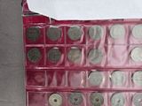 a picture of a box of coins with a note attached to it