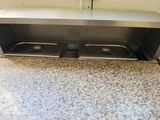 two trays that are under the counter in the kitchen