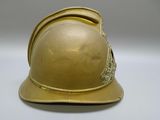 a gold helmet on a white table