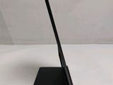 a close up of a laptop on a stand on a white surface