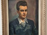 painting of a man in a blue sweater and white shirt in a gold frame