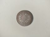 l'image d'une pièce de monnaie sur laquelle figure l'image d'un homme