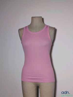a female mannequin wearing a pink tank top on a mannequin stand