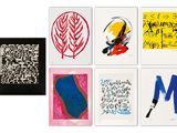 several different types of art work displayed on a white surface