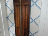 a grandfather clock that is in the corner of a room