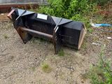 a bench that is sitting in the dirt near a building
