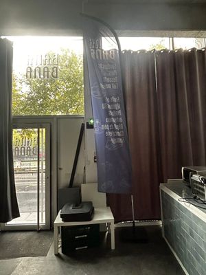 a blue banner hanging from the ceiling of a bathroom
