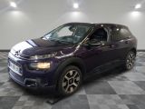 the purple citrole is parked on a checkered tile floor
