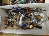 a white box filled with lots of assorted jewelry