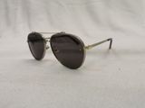 a close up of a pair of sunglasses on a white surface