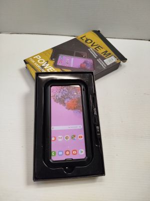 a box with a phone inside of it on a table