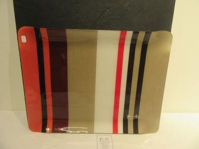a glass plate with a red, white, and black stripe design on it