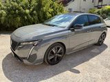 an image of a grey car parked in a driveway