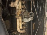 an old engine in the back of a truck