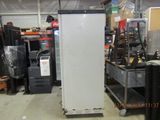a refrigerator that is sitting in the middle of a room