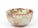 a bowl that is sitting on a white surface