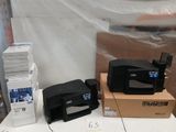 many different types of printers sitting on a table