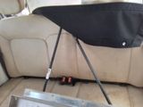 an image of a seat in a car with a bag on the back