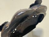 a close up of a sculpture of a bird on a table