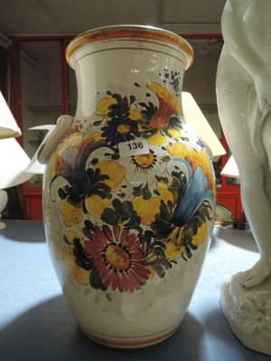 two vases that are sitting on a table