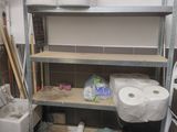 many rolls of toilet paper on the shelves in the bathroom