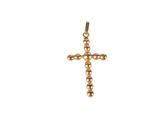 a gold cross pendant on a white background