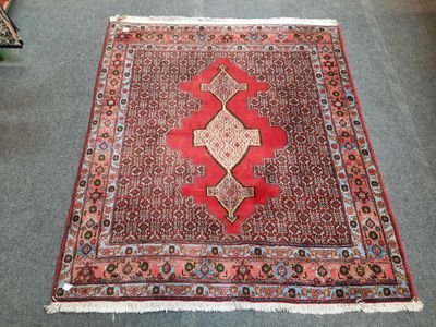 an image of a red rug on the floor in a living room