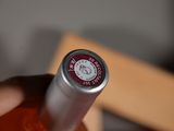 a bottle of wine that is in someone ' s hand