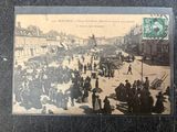 a picture of a postcard with a picture of a crowd of people on the street