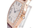 a close up of a wrist watch with diamonds on the bezel