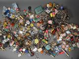 a pile of assorted key chains on a table