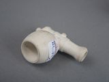 a small white vase with a sticker on the side of it