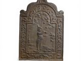 an old cast iron plaque with a man and a woman on it