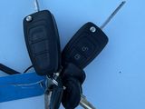 a bunch of car keys that are attached to a keychair