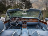 a view of the interior of a car from the driver ' s seat