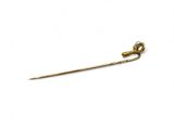 an image of a gold stick with a pearl on it