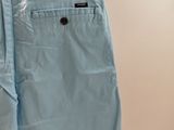 a close up of a pair of blue pants hanging on a wall