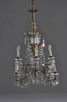 an image of a chandelier with three lights hanging from the ceiling